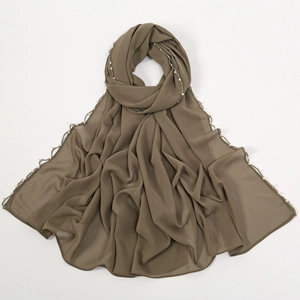 Close-up of coffee brown chiffon hijab featuring delicate white pearl beaded edges