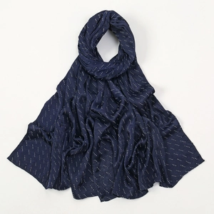 Detailed view of dark blue hijab scarf featuring white pearl bubble dotted line pattern