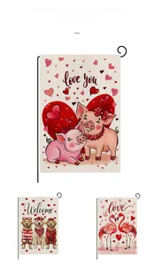 Detail of linen Valentine's garden flags featuring pink pigs, golden retrievers and flamingos