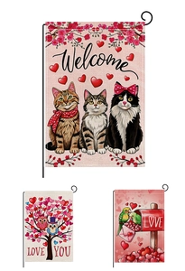 Detailed close-up of Valentine's garden flags featuring cats and heart patterns