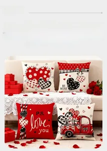Detailed close-up of 4 Valentine's pillow covers with heart and truck prints on a sofa