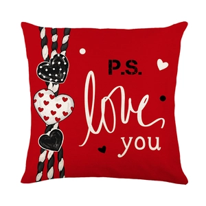Square red Valentine's Day pillowcase with P.S. Love You text and heart hanging charms