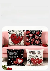 Close-up of four Valentine's Day pillow covers with heart prints on a pink sofa