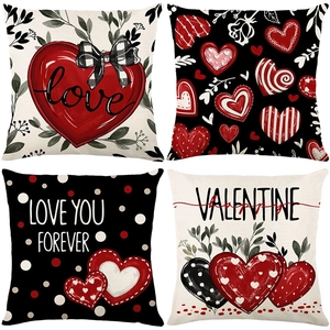 Set of four Valentines Day pillow covers with red and black heart patterns on linen fabric