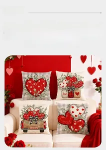 Detail of Valentine's pillow covers with red hearts and truck prints on white sofa