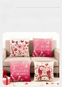 Detail of four Valentine's Day pillow covers with owls and hearts on a sofa