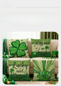 Set of four St. Patrick's Day pillow covers with green shamrock prints on a sofa