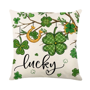 St. Patrick's Day throw pillow cover with green shamrocks, lucky text, and horseshoe print