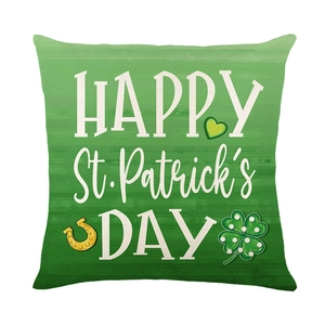 St. Patrick's Day green throw pillow cover with golden horseshoe and clover patterns