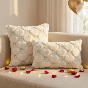 Plush Valentine cream pillow covers with faux fur hearts and gold bow embroidery