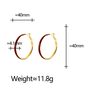 Detail showing 40mm diameter and 4.1mm width of gold-tone enamel hoop earrings
