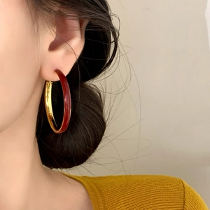 Elegant retro red enamel and gold metal hoop earrings for women in a minimalist style