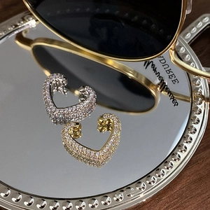 Luxurious heart-shaped ear cuffs with pavé cubic zirconia in gold and silver finishes
