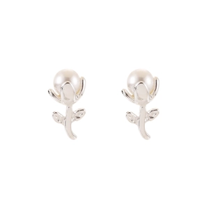 Detailed view of silver tulip-shaped pearl earrings with polished white pearls