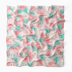 Detail of floral voile scarf with watercolor pink roses and green leaves on white background