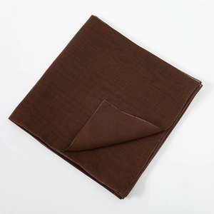 Close-up of coffee brown mercerized cotton scarf featuring delicate hemmed edges