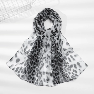 Close-up of lightweight leopard print chiffon scarf with classic black and grey pattern