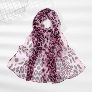 Detailed close-up of pink leopard print scarf in light translucent chiffon fabric