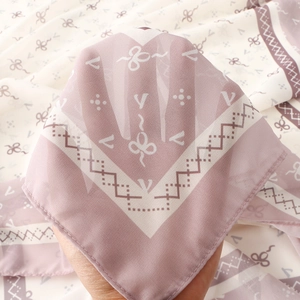 Close-up of semi-transparent floral print chiffon scarf with lightweight texture