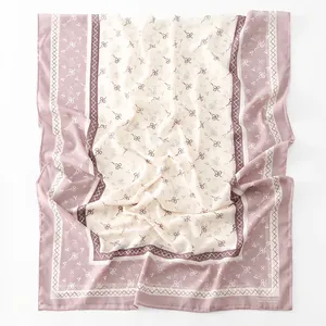 Elegant chiffon long scarf with floral and bow prints in soft pink and beige colors