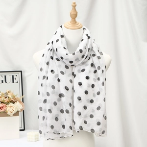 Lightweight white voile long scarf with large black polka dots on a white mannequin