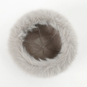 Detail of plush faux fur hat showing soft suede lining and premium stitching