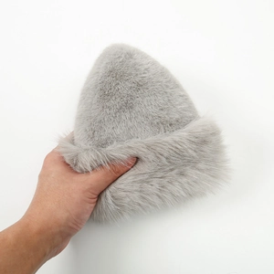 Detail shot showing the soft texture of the light gray faux fur plush winter beanie