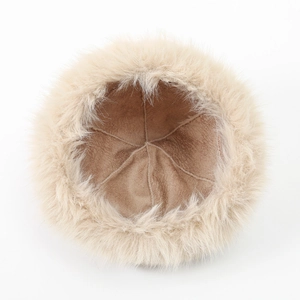 Detail of warm winter Mongolian hat featuring soft khaki suede lining and white faux fur trim
