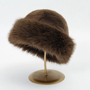 Detail of dark brown faux fur winter hat texture displayed on a metal stand