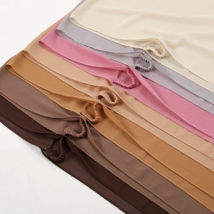 Detail of multi-color chiffon hijabs with elastic ear loops for adjustable fit