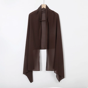 Detail of dark brown pearl chiffon hijab fabric texture and elastic band on wooden hanger