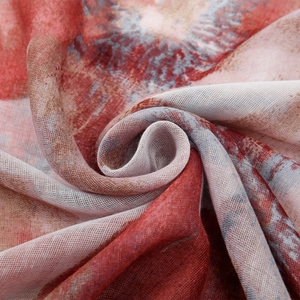Macro shot showing soft floral texture and translucent voile fabric of the printed scarf