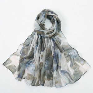 Close-up of semi-transparent bali yarn scarf with colorful abstract floral print