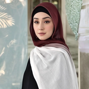 Detail of burgundy pink white gradient modal hijab with breathable texture and neat stitching