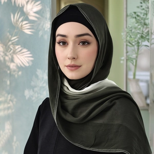 Detail of dark olive hijab with contrast stitching and black underscarf for women