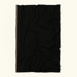 Black knitted headscarf with champagne gold sequin trim and soft pleated texture