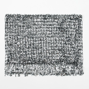 Detail of silver sequins on black mesh fabric with fringe for party evening shawl