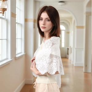 Elegant white floral lace triangle shawl with delicate hollow embroidery on a model
