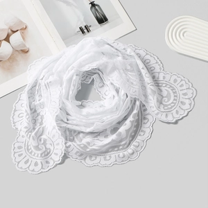 Detailed view of floral lace pattern on a white polyester triangle scarf for women
