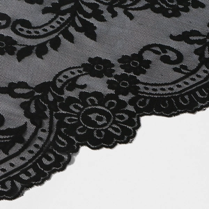 Detail of black bridal lace veil with floral embroidery and scalloped edge design