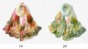 Detail of floral chiffon scarves in pink-orange and green-yellow lotus prints