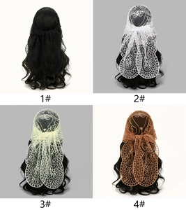 Detail of floral lace embroidery on sheer mesh headscarves in four assorted colors