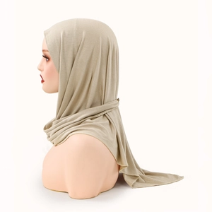 Detail of khaki cross-wrap hijab showing fine-knit texture and soft edge finish