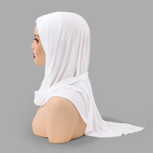 Detail of white cross-wrap hijab scarf showing soft breathable cotton fabric texture