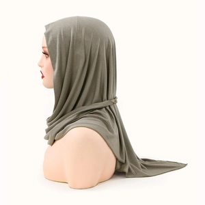 Detail view of premium bean green elastic knitted hijab with pleated drape and soft texture
