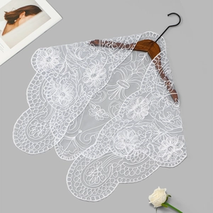 Close-up of intricate white floral embroidery on premium mesh lace scarf for women