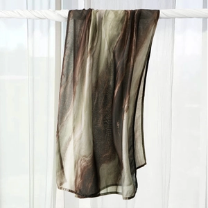 Detail of marble pattern on lightweight cotton turban wrap with elegant draped texture