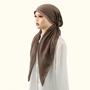 Close-up of brown cotton linen hijab featuring intricate rhinestone detailing and soft fabric