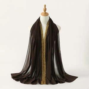 Detailed view of dark brown chiffon scarf featuring intricate gold lace embroidery