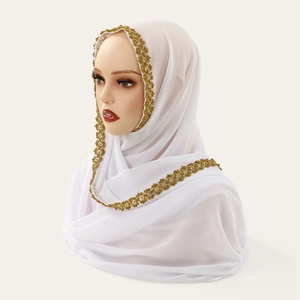 Detailed view of white chiffon hijab featuring elegant gold floral lace trim borders